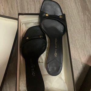 Used slip on Sandal with heels. In good condition